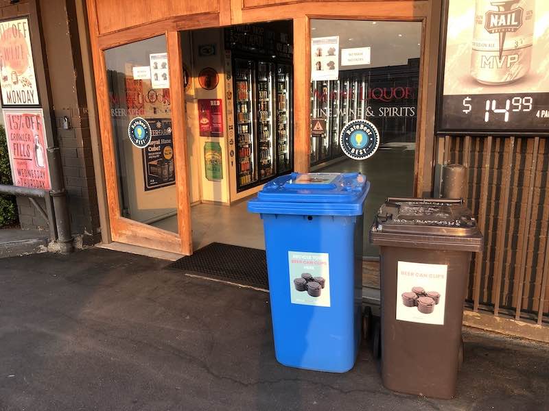 Bins for collecting beer clips at Mane Liquor 